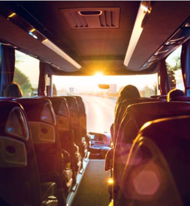 Interior of a charter bus while on the road